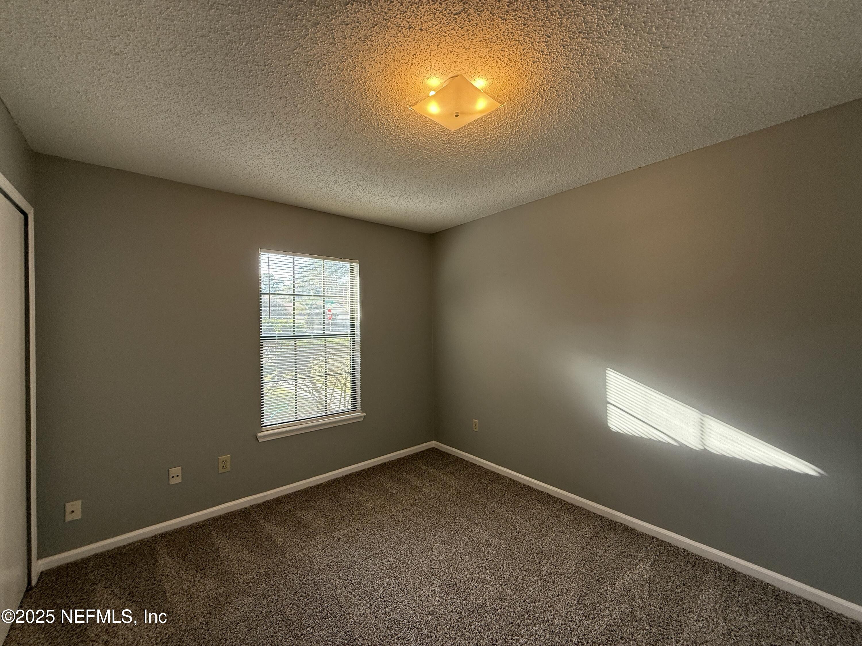 325 Quebec Lane Jacksonville, FL 32225 - Photo 17 of 24 an empty room with a window