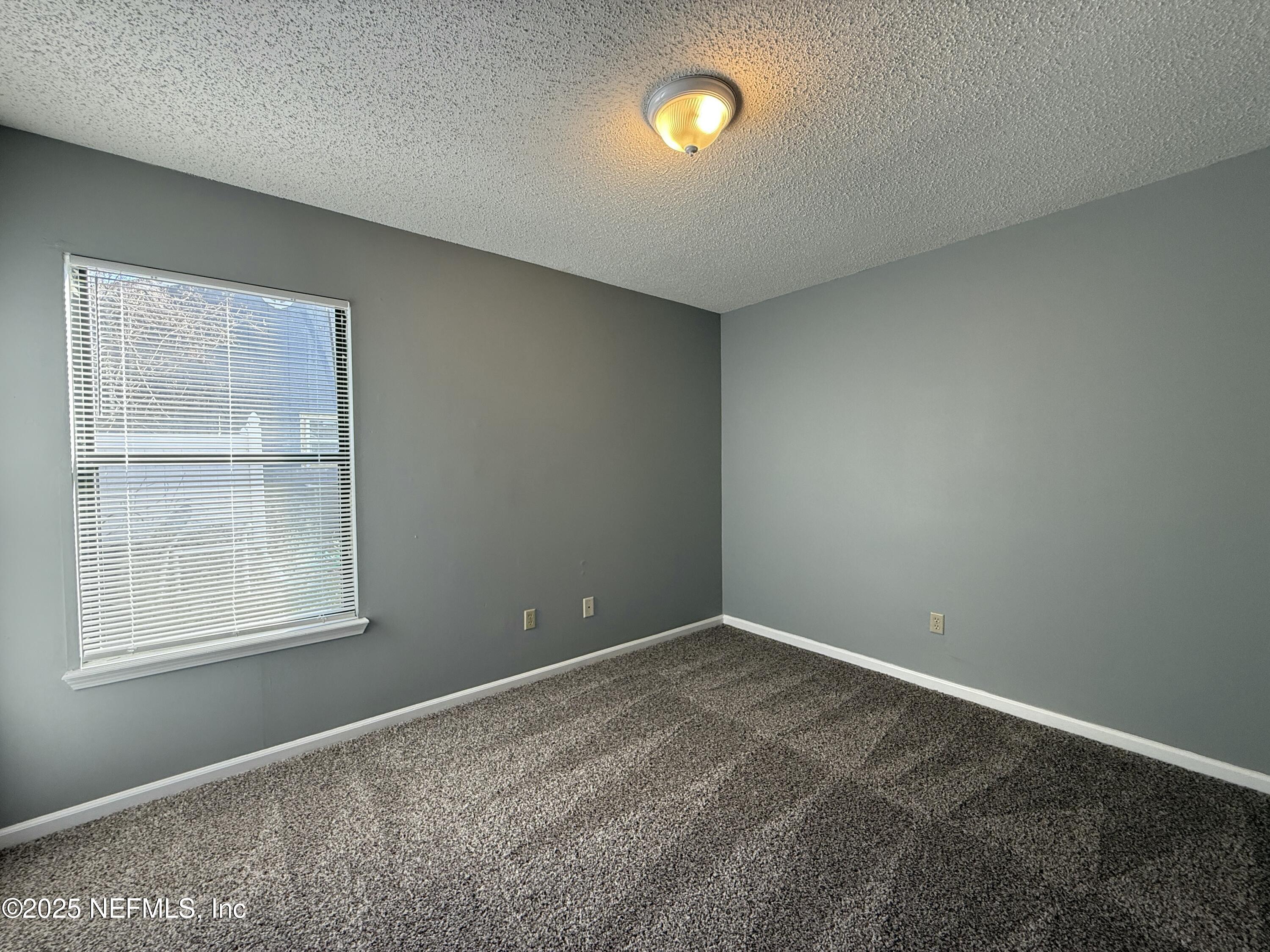 325 Quebec Lane Jacksonville, FL 32225 - Photo 18 of 24 an empty room with a window