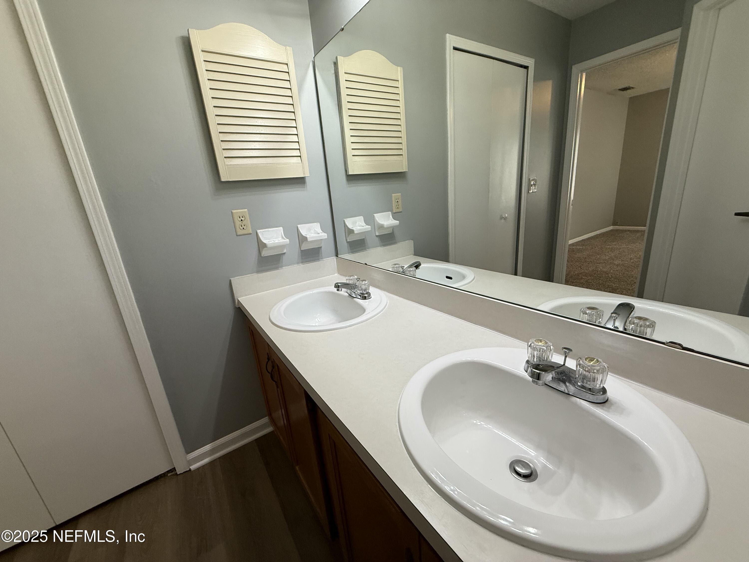 325 Quebec Lane Jacksonville, FL 32225 - Photo 21 of 24 a bathroom with a sink and a mirror