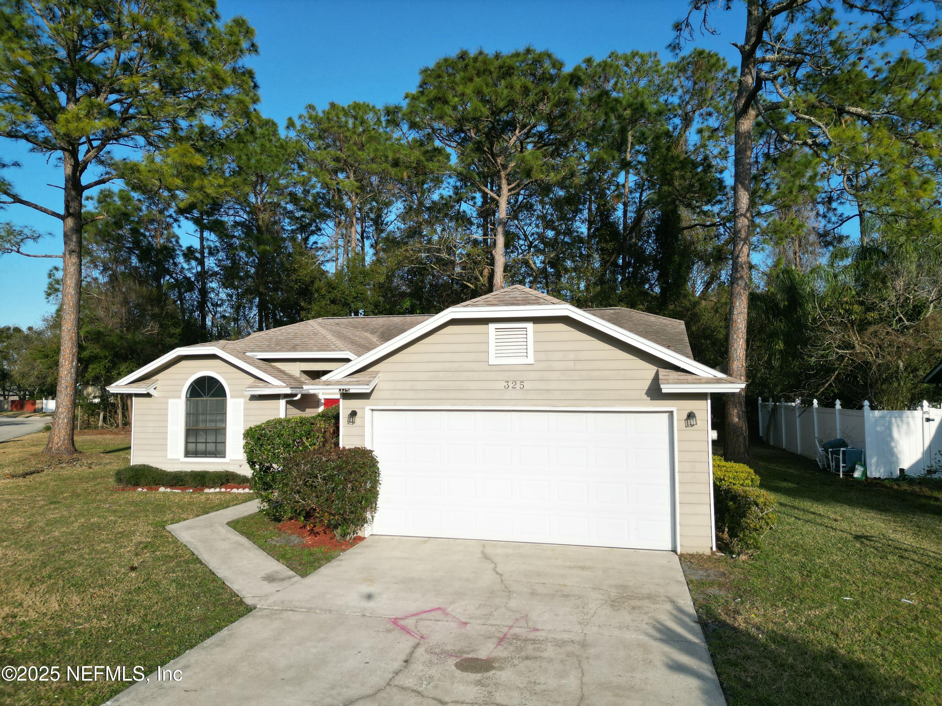 325 Quebec Lane Jacksonville, FL 32225 - Photo 22 of 24 a front view of a house with a yard