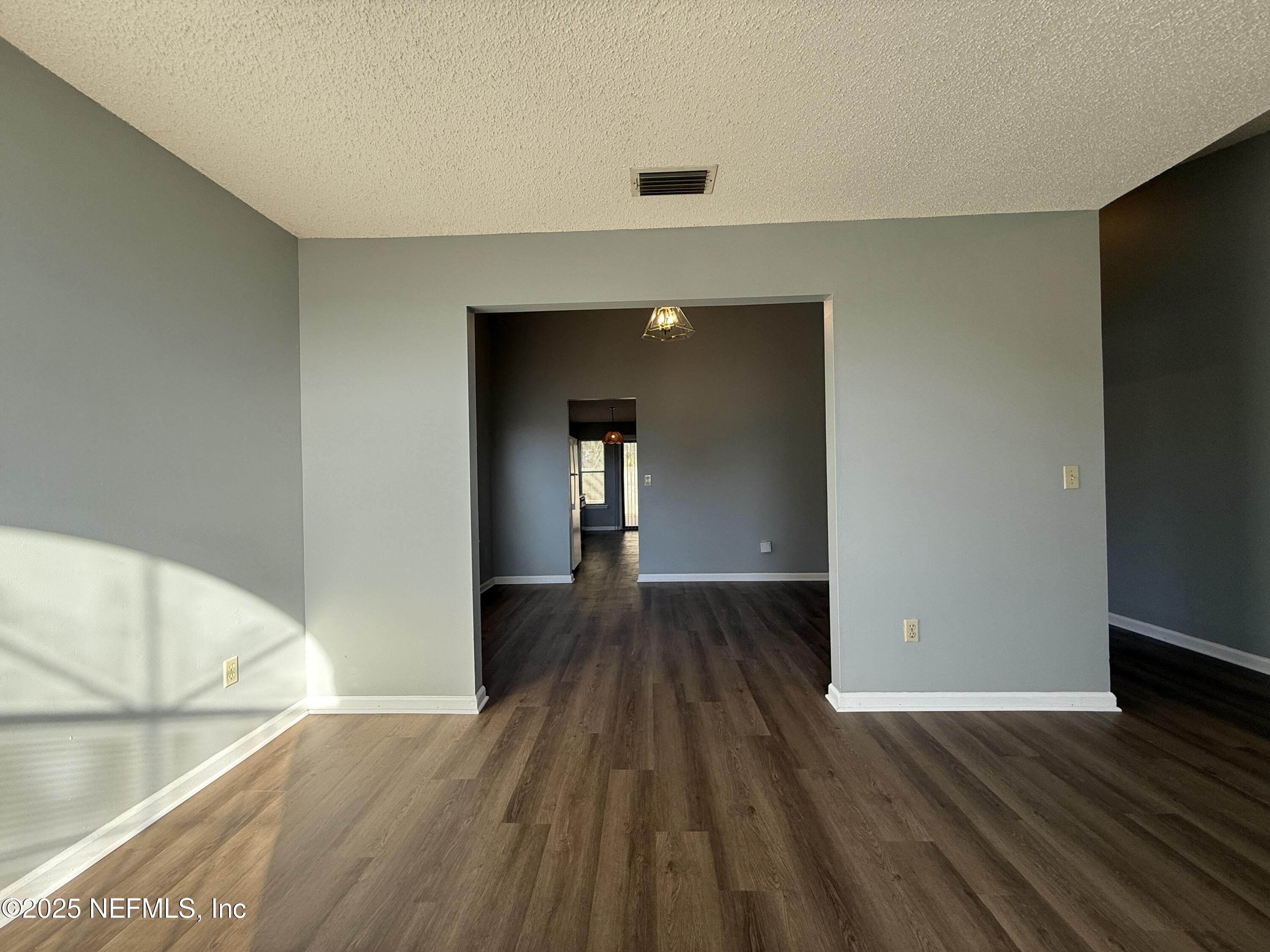325 Quebec Lane Jacksonville, FL 32225 - Photo 4 of 24 a view of empty room with wooden floor