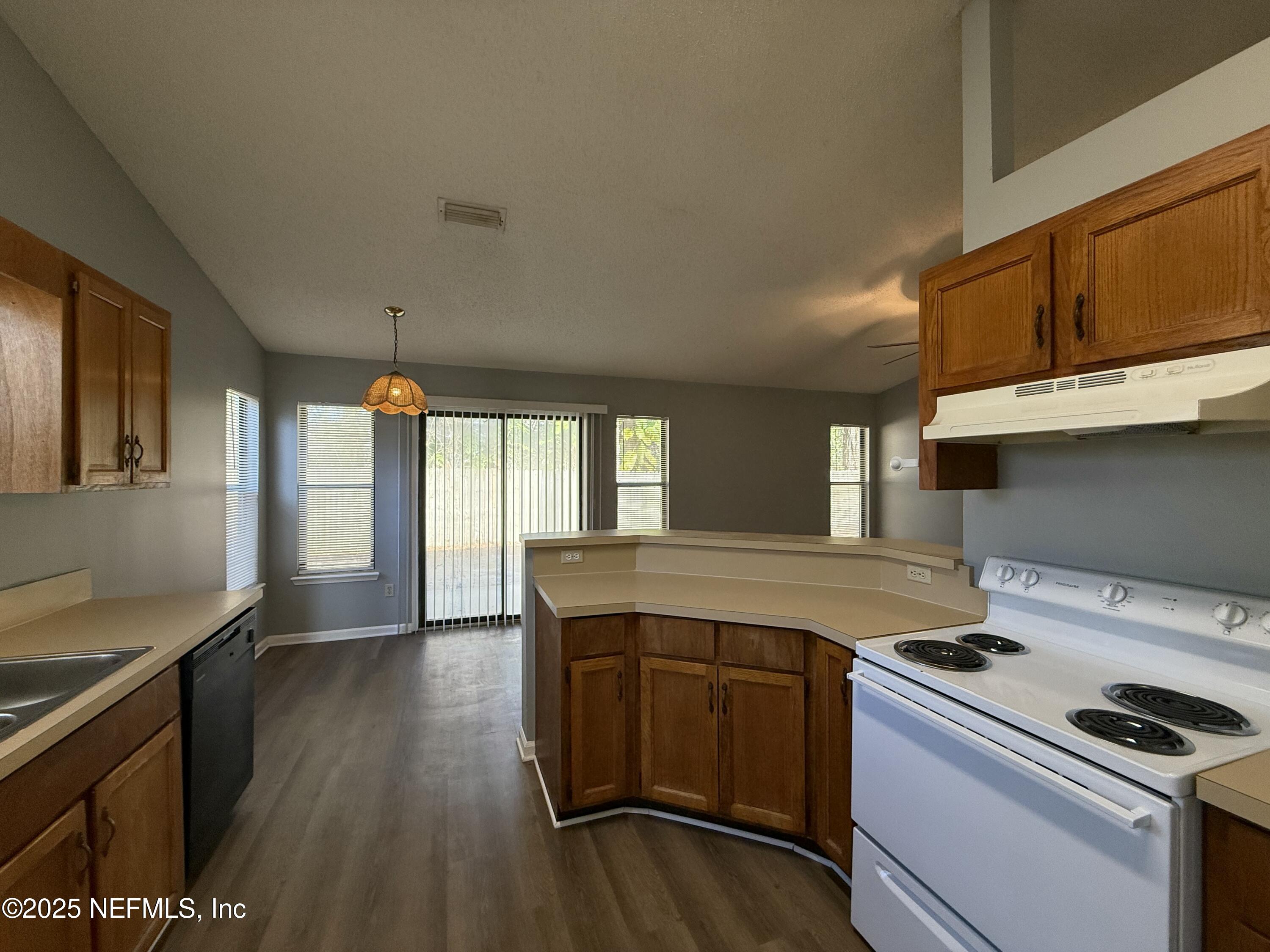 325 Quebec Lane Jacksonville, FL 32225 - Photo 9 of 24 a kitchen that has a sink and a stove