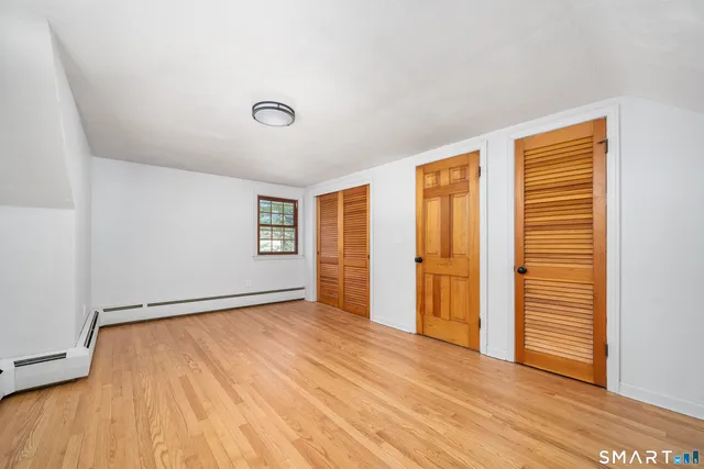 a bathroom with a sink a mirror and a toilet