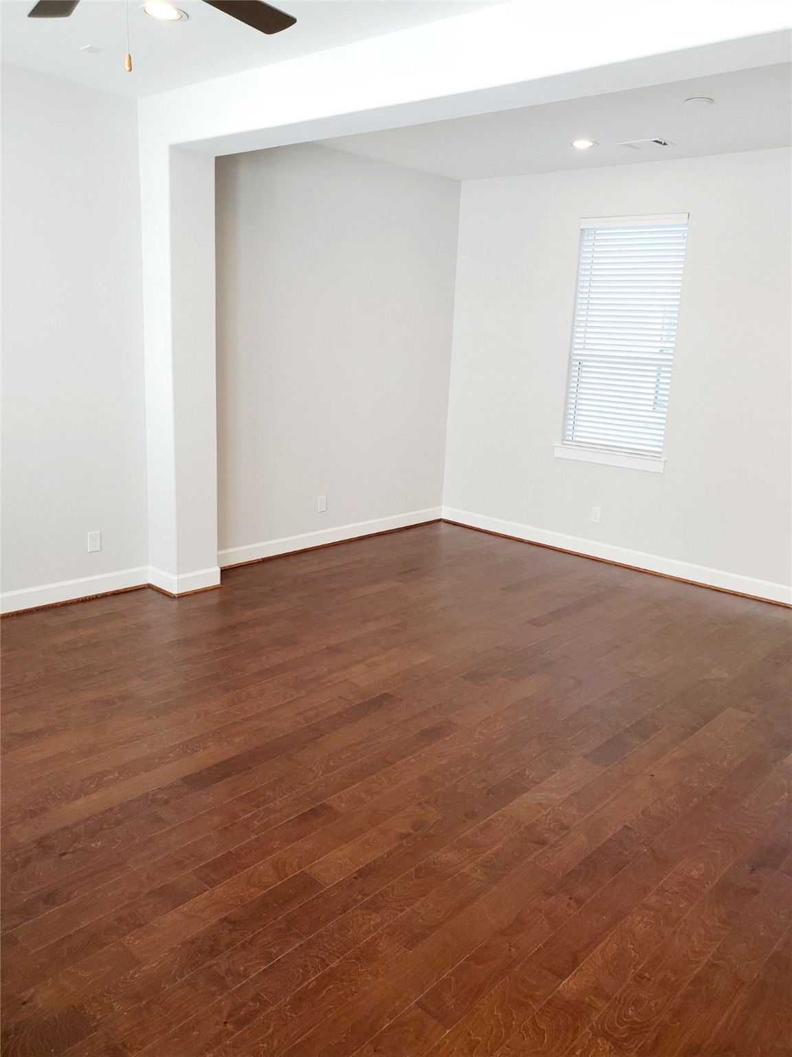 720 C Link Road Houston, TX 77009 - Photo 11 of 40 a view of an empty room with wooden floor and a window
