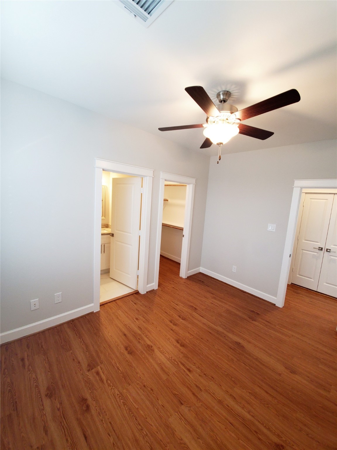 720 C Link Road Houston, TX 77009 - Photo 22 of 40 a view of an empty room with a window and wooden floor