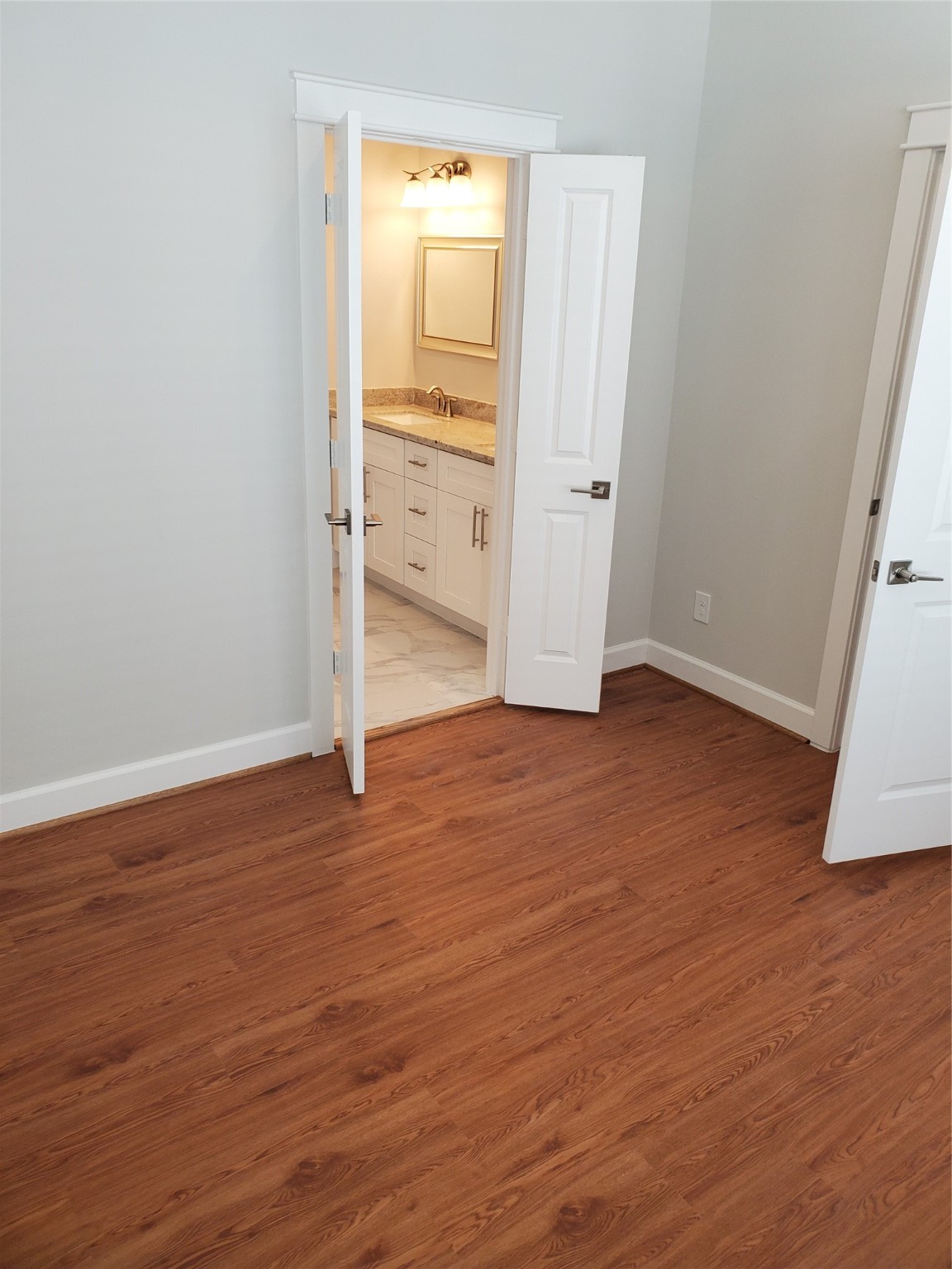 720 C Link Road Houston, TX 77009 - Photo 24 of 40 an empty room with wooden floor and closet