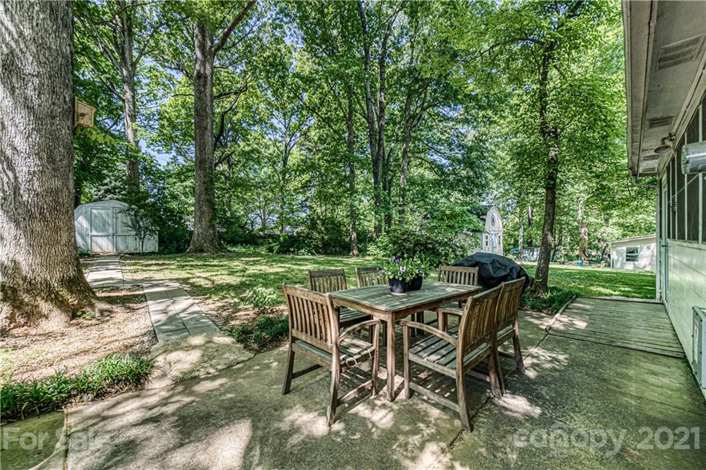 11328 Torino Road Matthews, NC 28105 - Photo 2 of 23 a view of a chairs and fire pit in the backyard