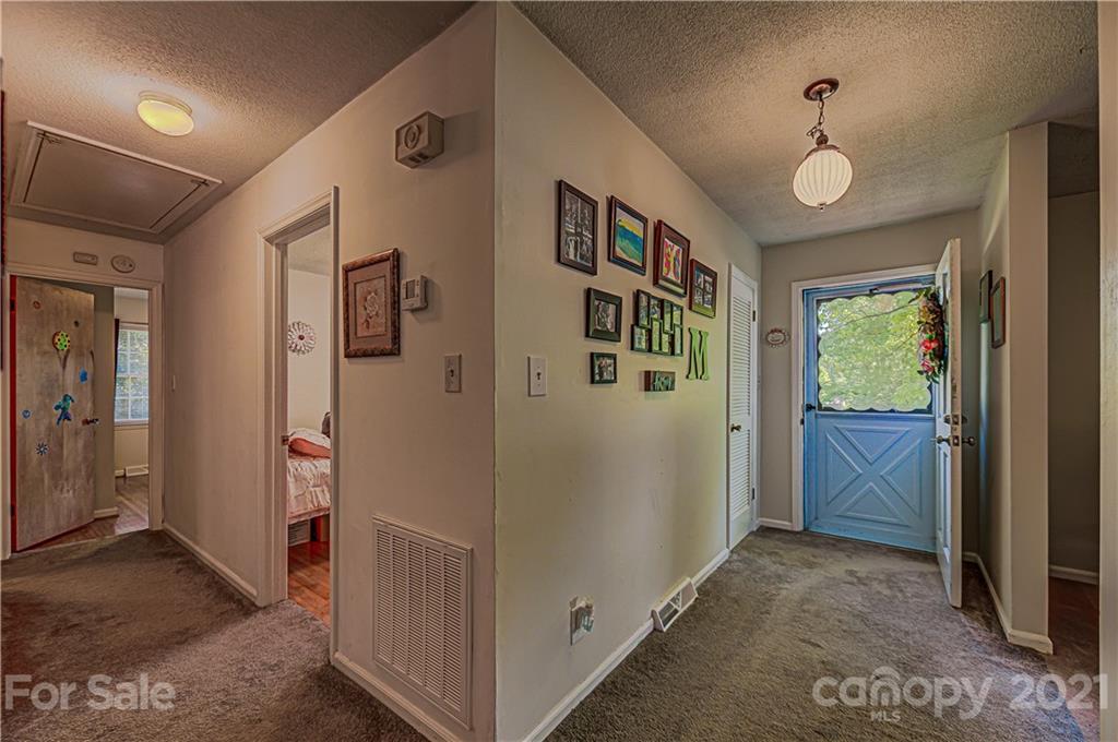 11328 Torino Road Matthews, NC 28105 - Photo 11 of 23 a view of entryway with window and hallway