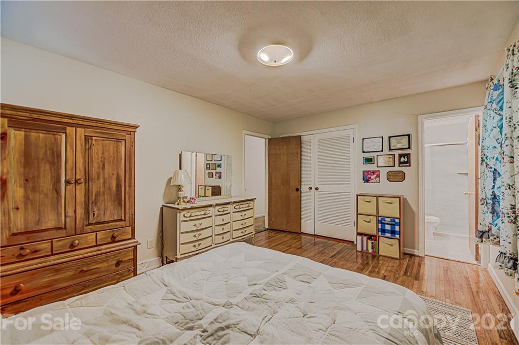11328 Torino Road Matthews, NC 28105 - Photo 14 of 23 a bedroom with a bed and a closet