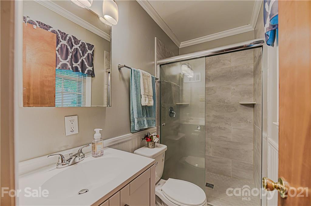 11328 Torino Road Matthews, NC 28105 - Photo 15 of 23 a bathroom with a sink toilet and shower