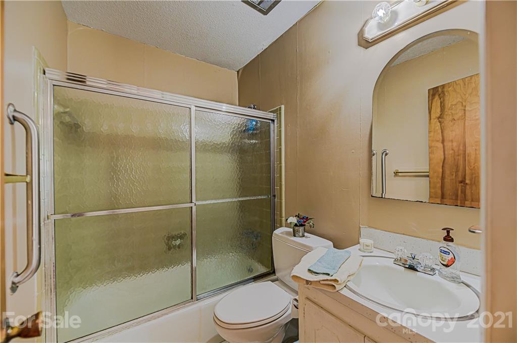 11328 Torino Road Matthews, NC 28105 - Photo 17 of 23 a bathroom with a sink toilet and shower