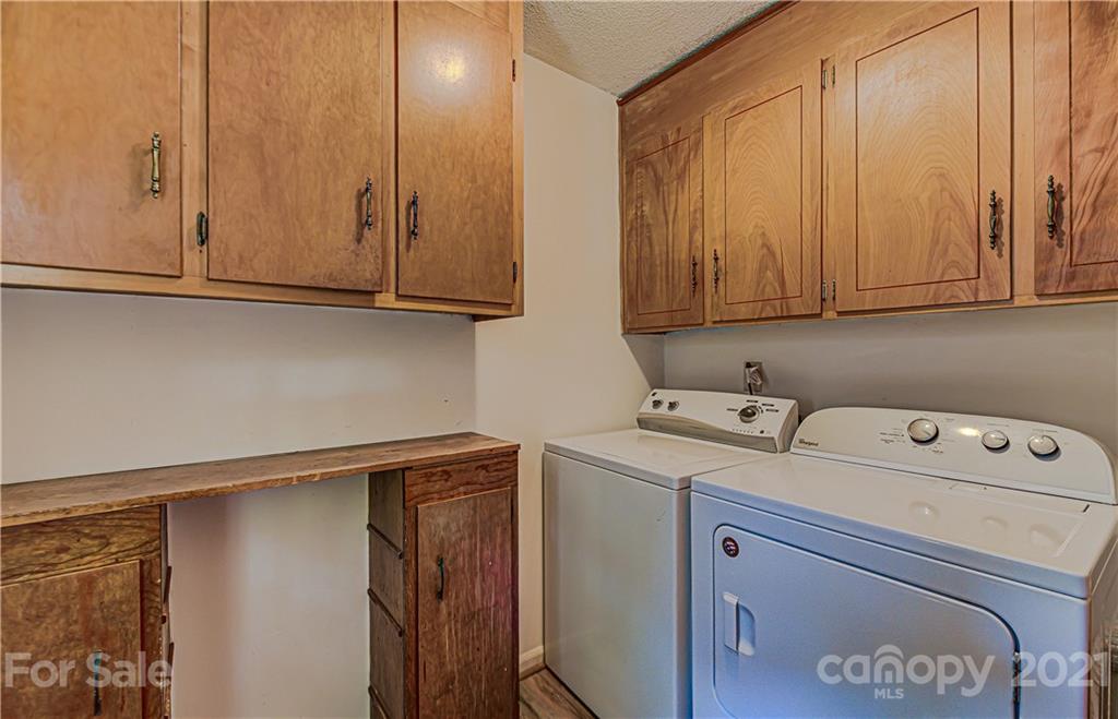 11328 Torino Road Matthews, NC 28105 - Photo 19 of 23 a utility room with dryer and washer
