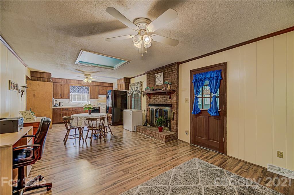 11328 Torino Road Matthews, NC 28105 - Photo 6 of 23 a view of a dining room with furniture and wooden floor