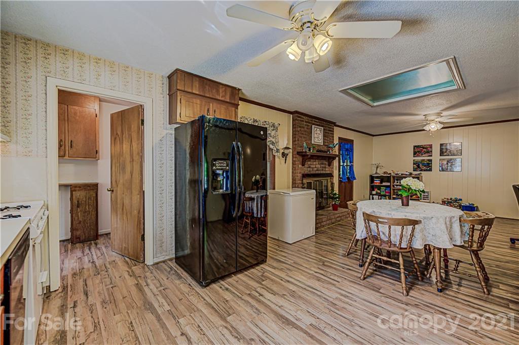 11328 Torino Road Matthews, NC 28105 - Photo 8 of 23 a view of a dining room with furniture window and wooden floor