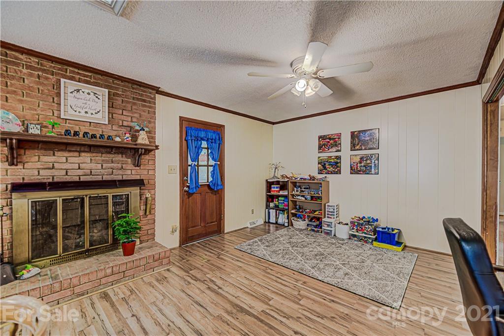 11328 Torino Road Matthews, NC 28105 - Photo 10 of 23 a bed room with a bed and a fireplace