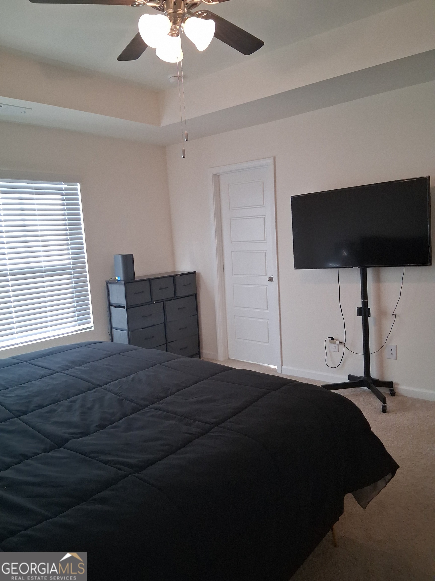 2685 Paxton Place Decatur, GA 30034 - Photo 12 of 17 a bedroom with a bed and a chandelier