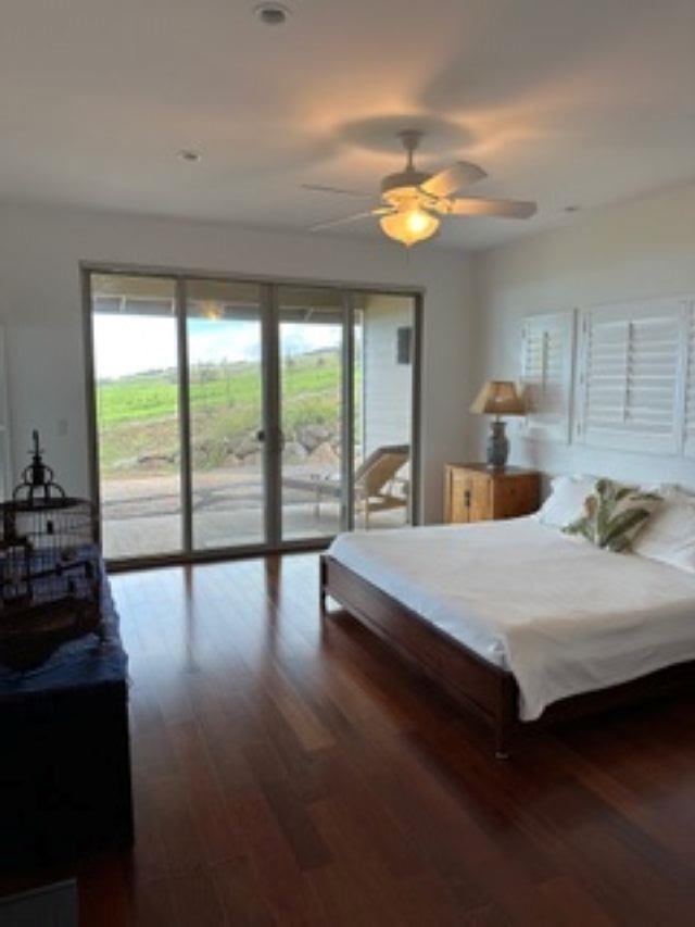 1141 Lower Kimo Drive Kula, HI 96790 - Photo 13 of 34 a spacious bedroom with a large bed and a large window