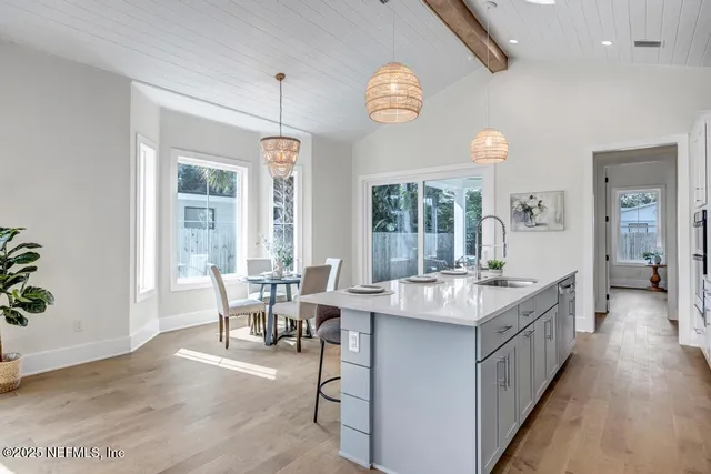 a kitchen with center island and windows