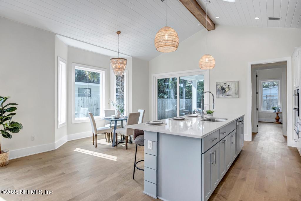 552 Seagate Avenue Neptune Beach, FL 32266 - Photo 11 of 29 a kitchen with center island and windows