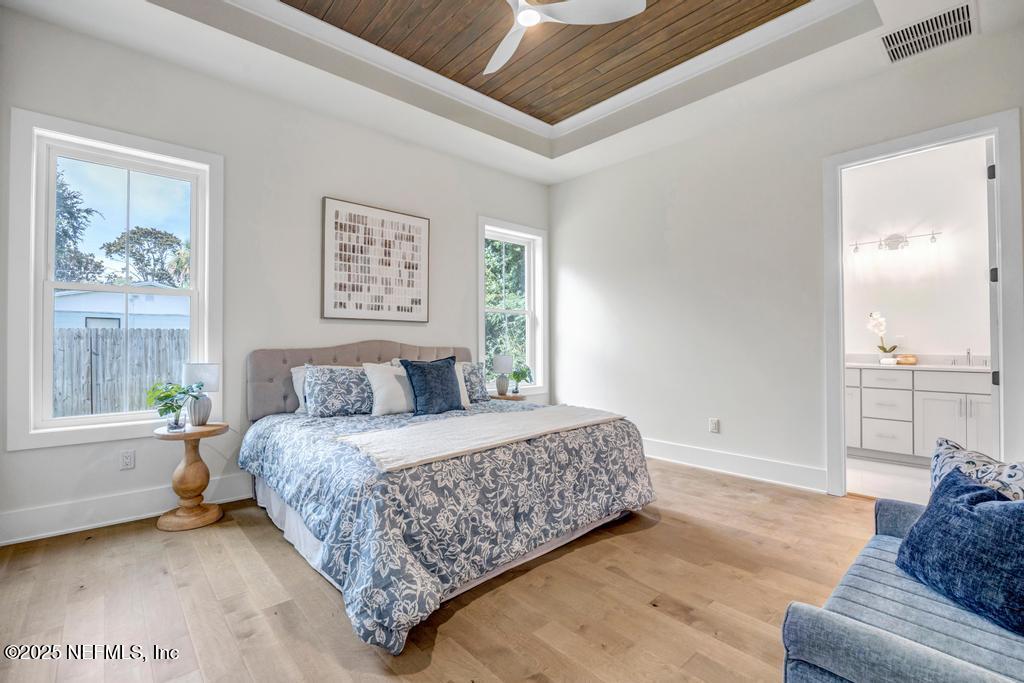 552 Seagate Avenue Neptune Beach, FL 32266 - Photo 5 of 29 a bedroom with a bed and window