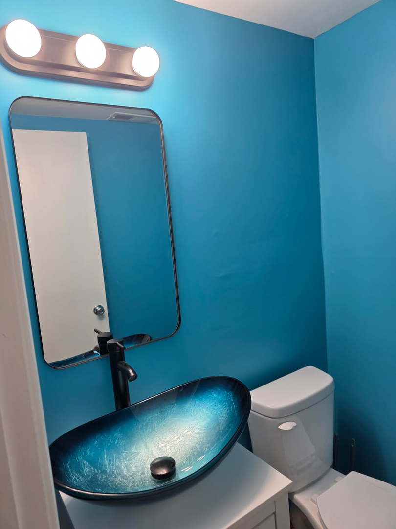 67 Woodhills Bay Road Fox Lake, IL 60020 - Photo 16 of 27 a bathroom with a toilet and a mirror