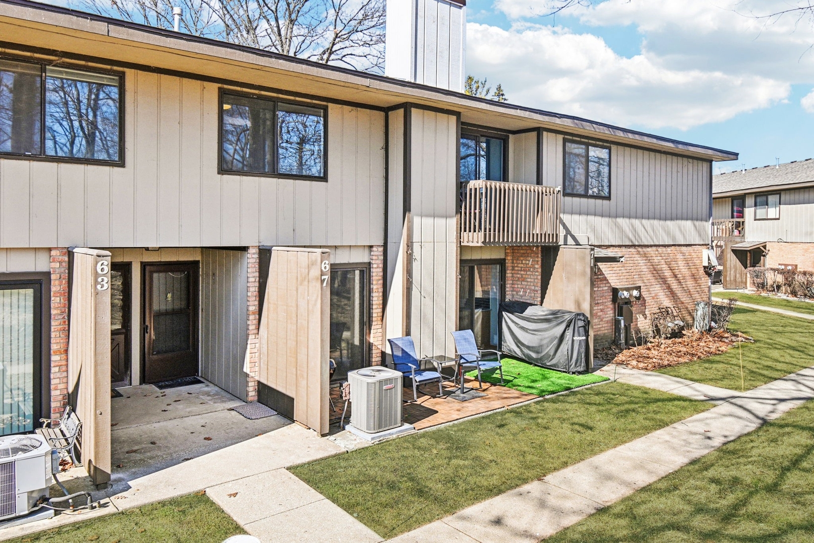 67 Woodhills Bay Road Fox Lake, IL 60020 - Photo 20 of 27 a view of a house with backyard and porch