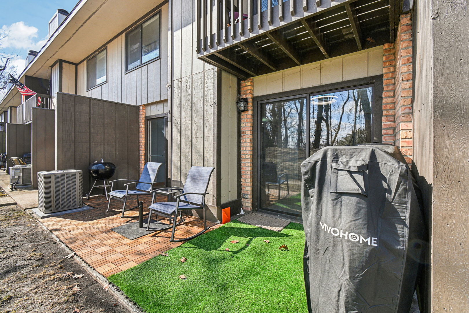 67 Woodhills Bay Road Fox Lake, IL 60020 - Photo 21 of 27 a view of backyard with wheel chair potted plant and a large window