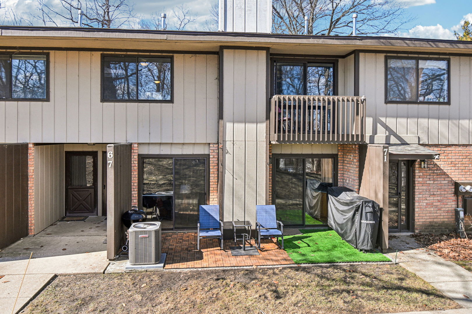 67 Woodhills Bay Road Fox Lake, IL 60020 - Photo 22 of 27 a front view of a house with garden