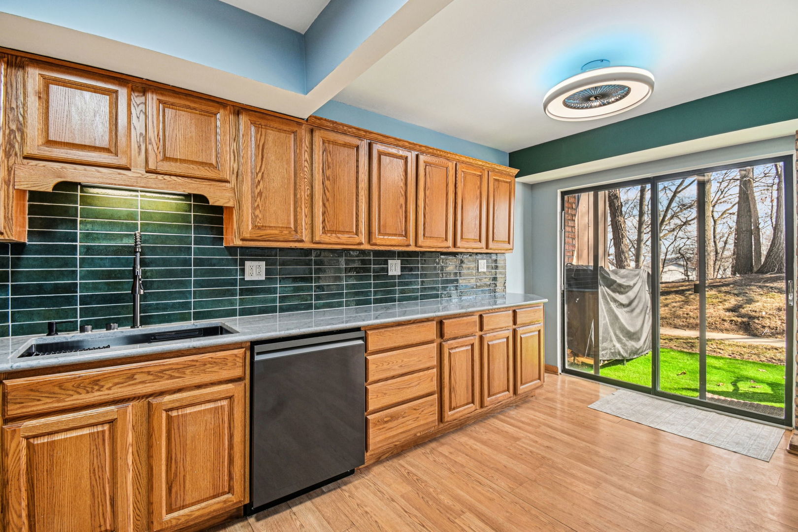 67 Woodhills Bay Road Fox Lake, IL 60020 - Photo 3 of 27 a kitchen with stainless steel appliances granite countertop a stove a sink and a microwave