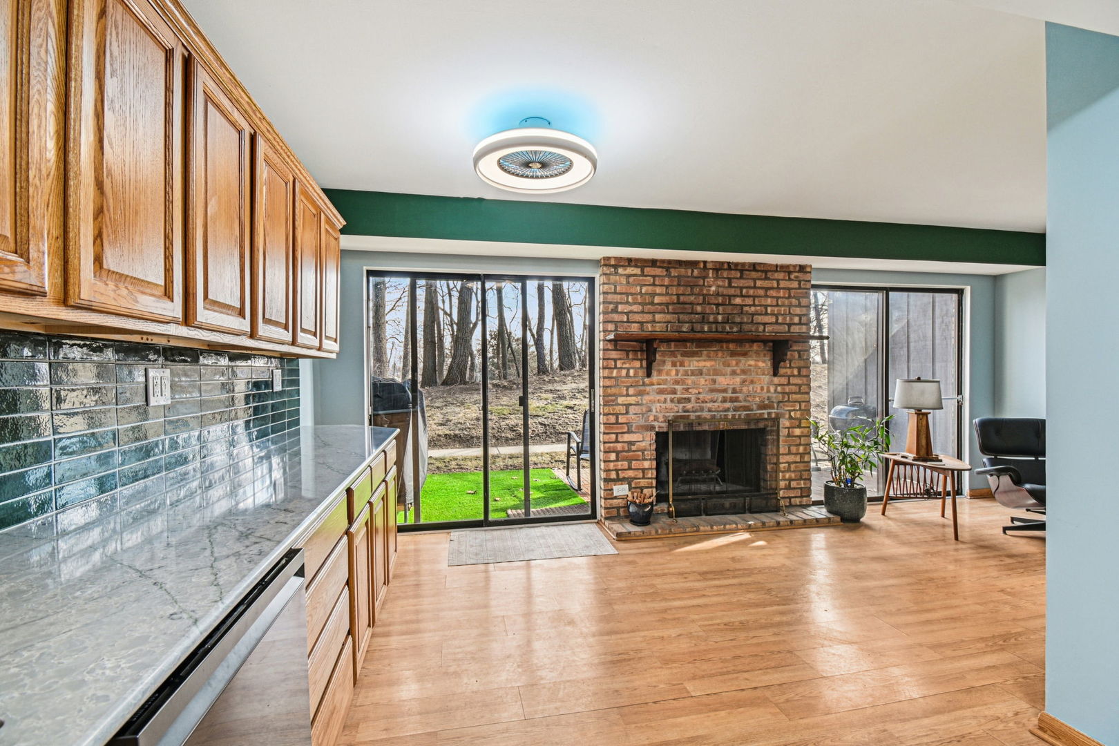67 Woodhills Bay Road Fox Lake, IL 60020 - Photo 4 of 27 a view of kitchen with furniture and fireplace