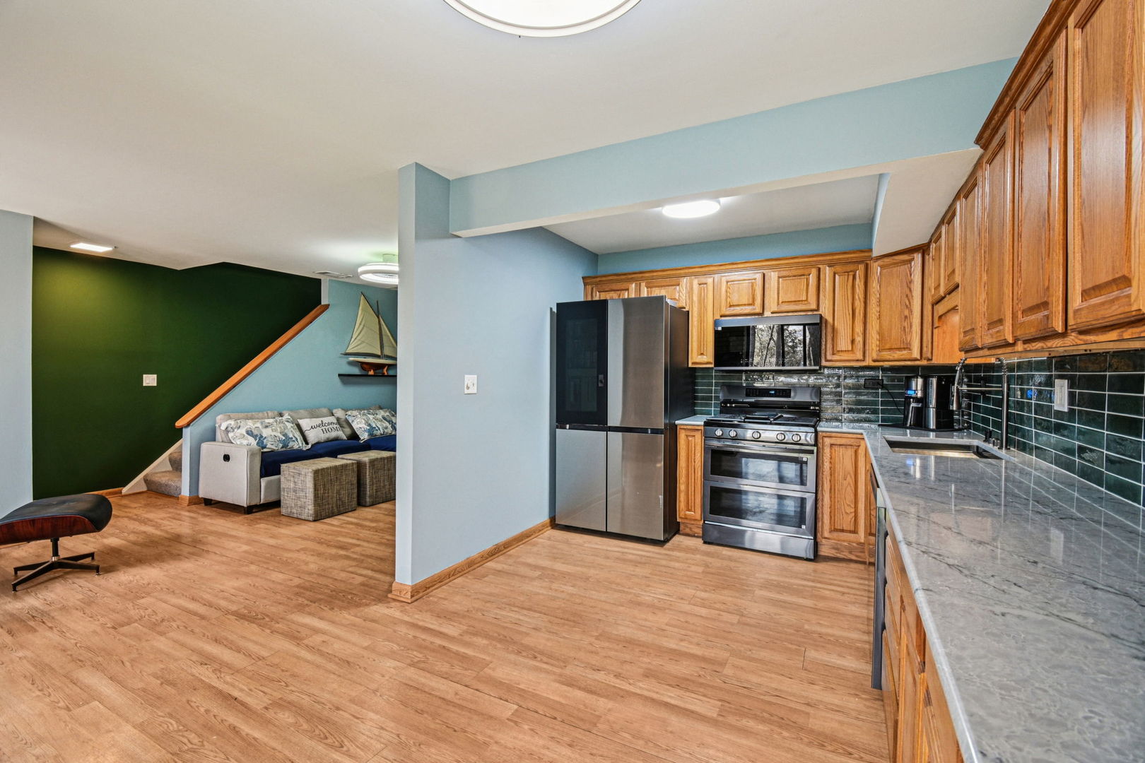 67 Woodhills Bay Road Fox Lake, IL 60020 - Photo 5 of 27 a kitchen with stainless steel appliances kitchen island granite countertop a refrigerator a stove a sink and dishwasher
