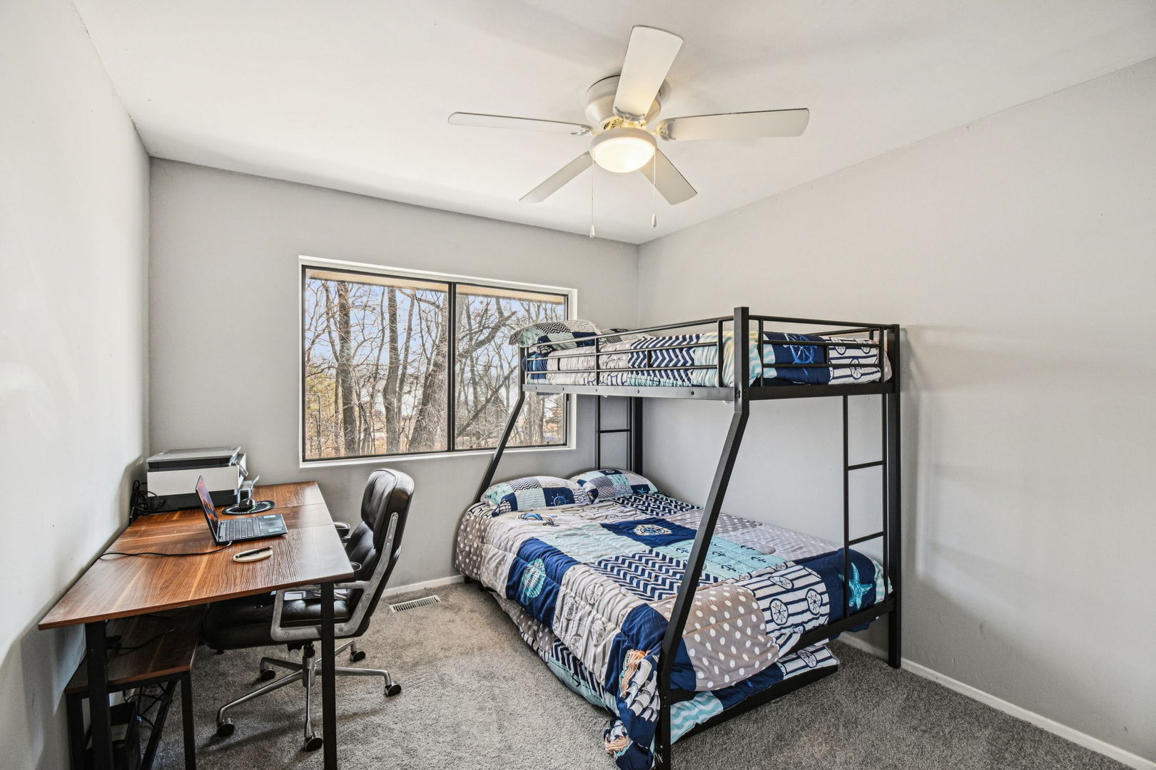 67 Woodhills Bay Road Fox Lake, IL 60020 - Photo 10 of 27 a bedroom with a bed a desk and chair