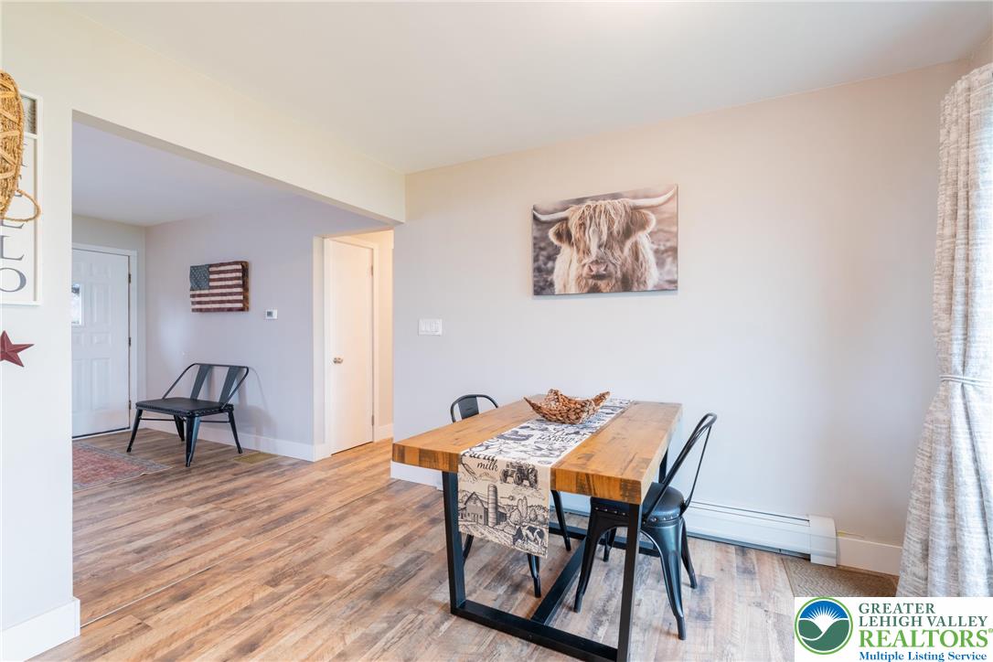 677 English Road Bath, PA 18014 - Photo 13 of 26 a view of a dining room with furniture and wooden floor