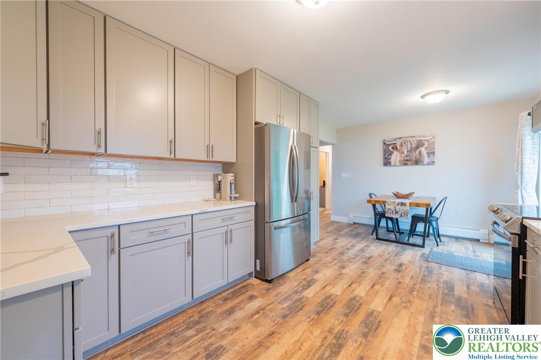 677 English Road Bath, PA 18014 - Photo 10 of 26 a kitchen with stainless steel appliances a refrigerator and a stove top oven