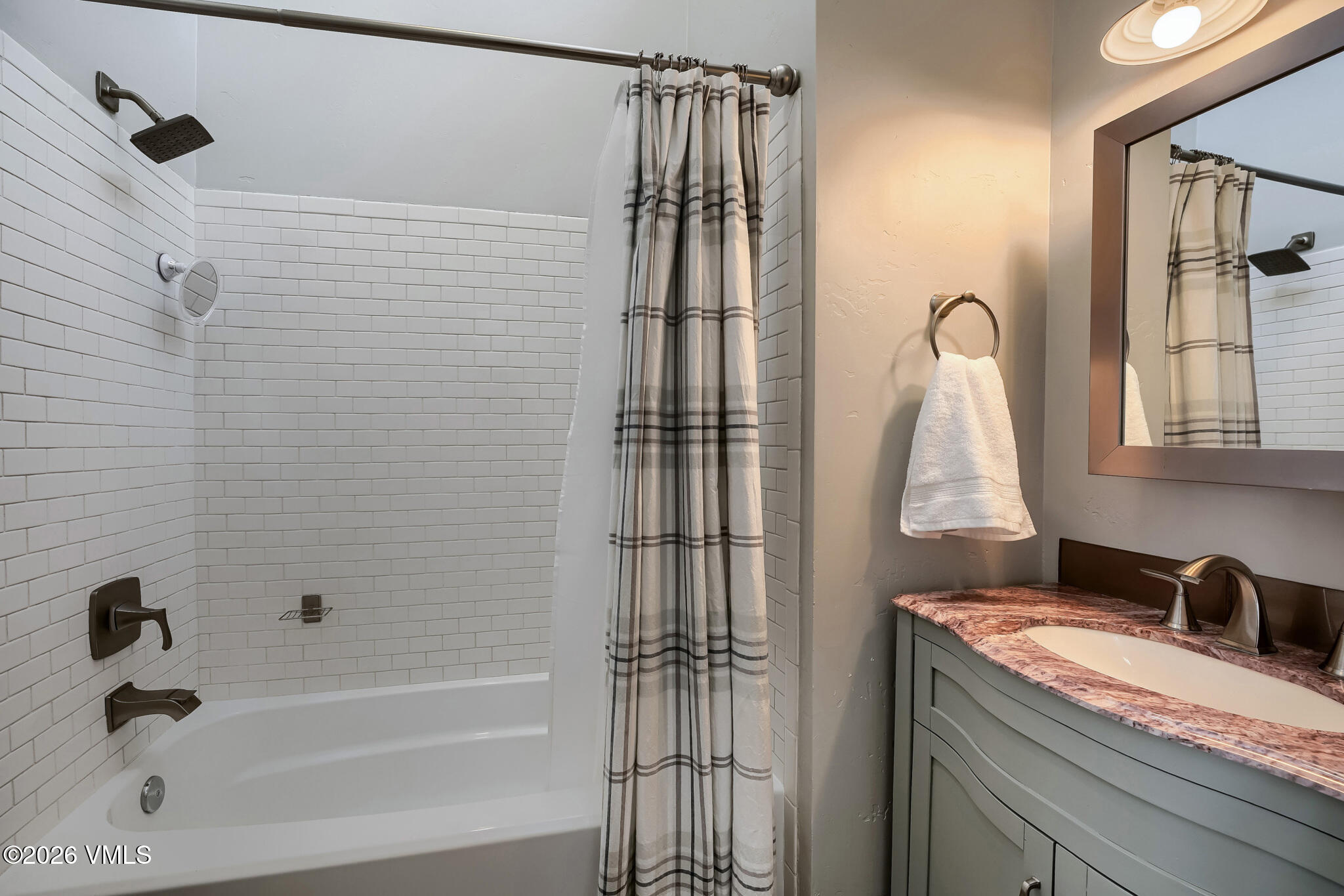 142 Eagle Drive, Unit C1 Avon, CO 81620 - Photo 15 of 20 a bathroom with a granite countertop sink a vanity and shower