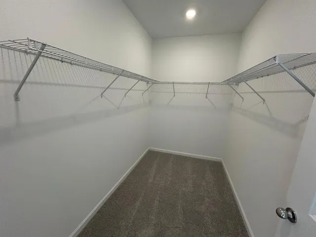 a view of a room with racks on the wall