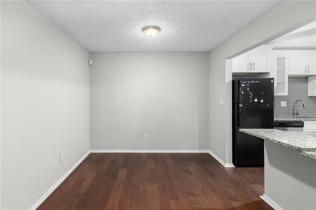 a view of a kitchen with a sink and dishwasher