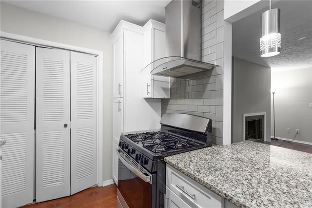 a kitchen with a stove and a cabinet