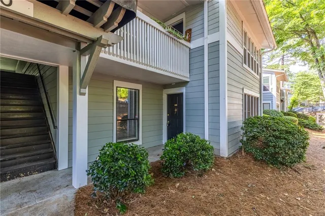 a view of a house with brick walls and windows