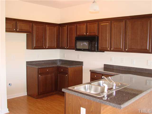 Representational photo of completed unit identical flooe plan . cosmetic differences could be in the subject property such as counter tops color , etc .