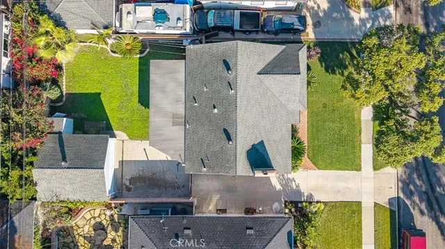 an aerial view of a house with a swimming pool