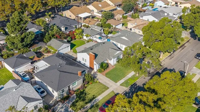 an aerial view of a house with a yard and garden