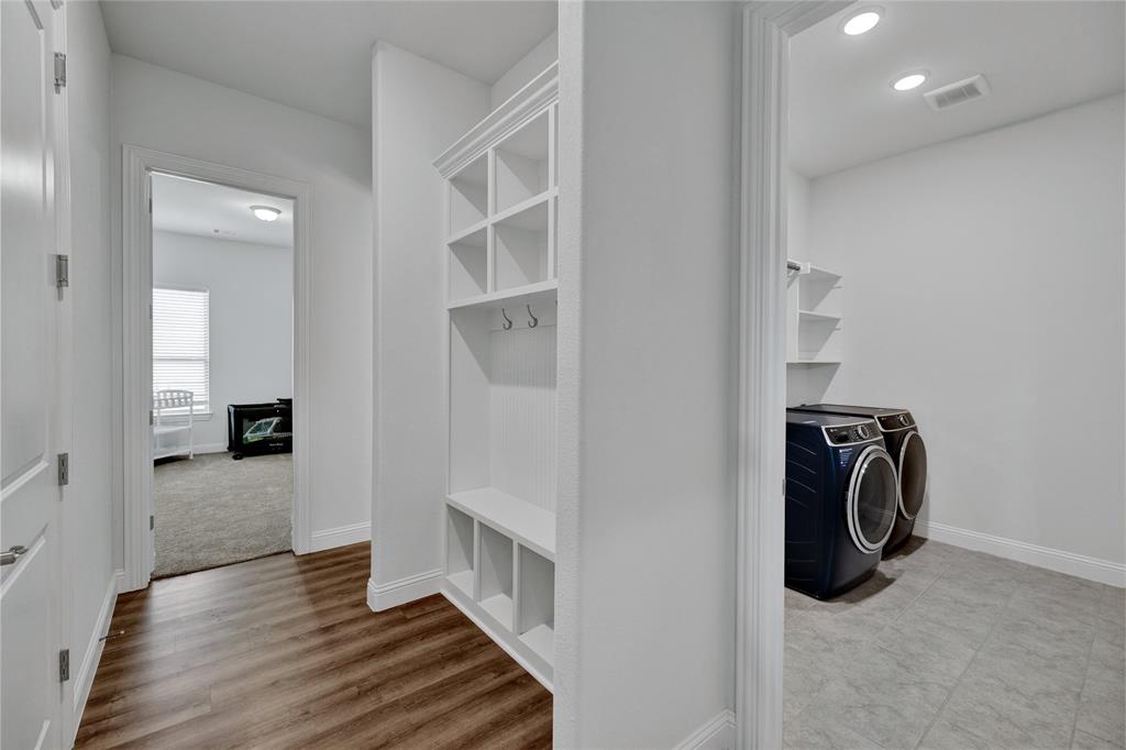 2307 Sam Street Mansfield, TX 76063 - Photo 18 of 23 Mudroom featuring washer and dryer and light wood-type flooring