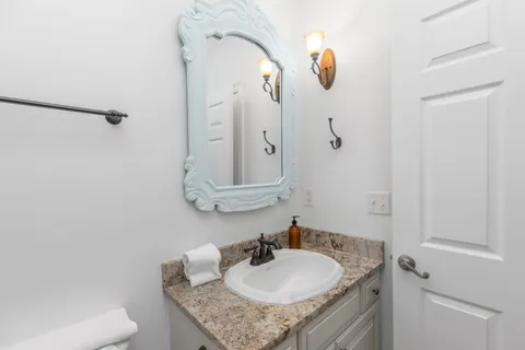 a view of a livingroom with furniture wooden floor and windows