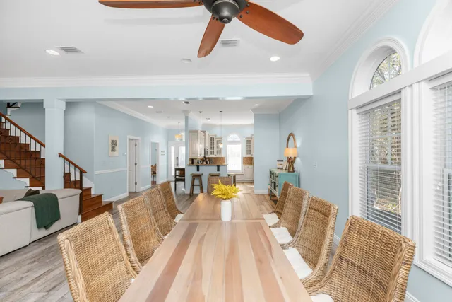a living room with furniture ceiling fan and a rug