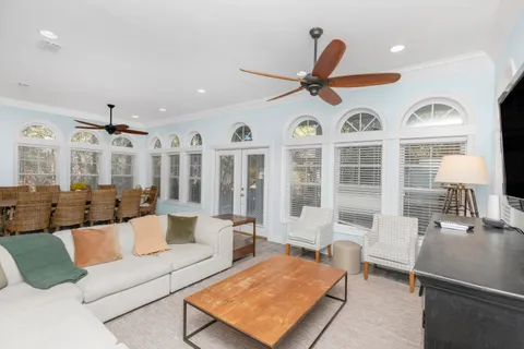 a kitchen with granite countertop a stove a sink and a window
