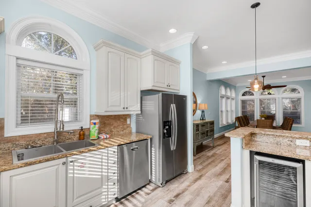 a bedroom with a bed a table and chair