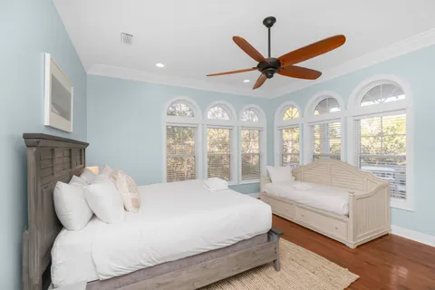 a bathroom with a granite countertop sink a mirror and a bathtub