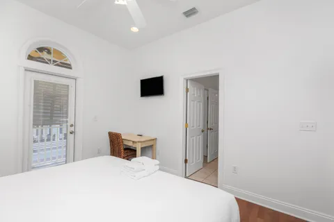 a front view of a house with garden and plants