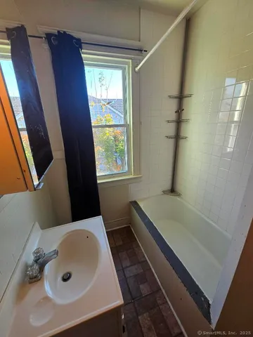 a bathroom with a sink and a tub